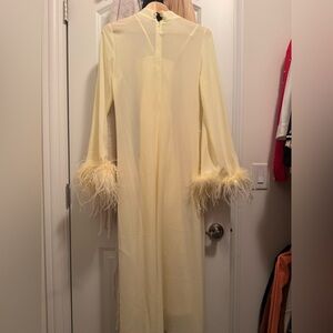 Yellow Straight midi dress with feathers on the cuffs